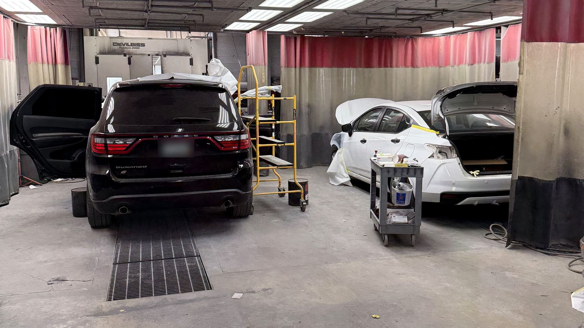 Cars in the paint booth at Redford Auto Repair and Collision on Inkster Road